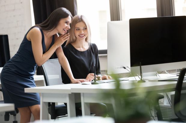 Female mentoring a young women entrepreneur