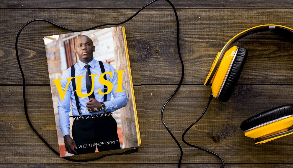 A book by Vusi Thembekwayo: Business and Life Lessons From a Black Dragon on a desk with a set of yellow headphones next to it.