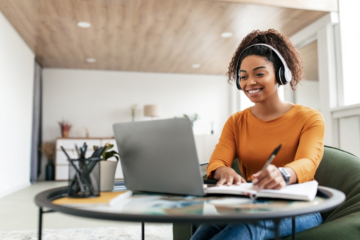 Woman on a computer smiling